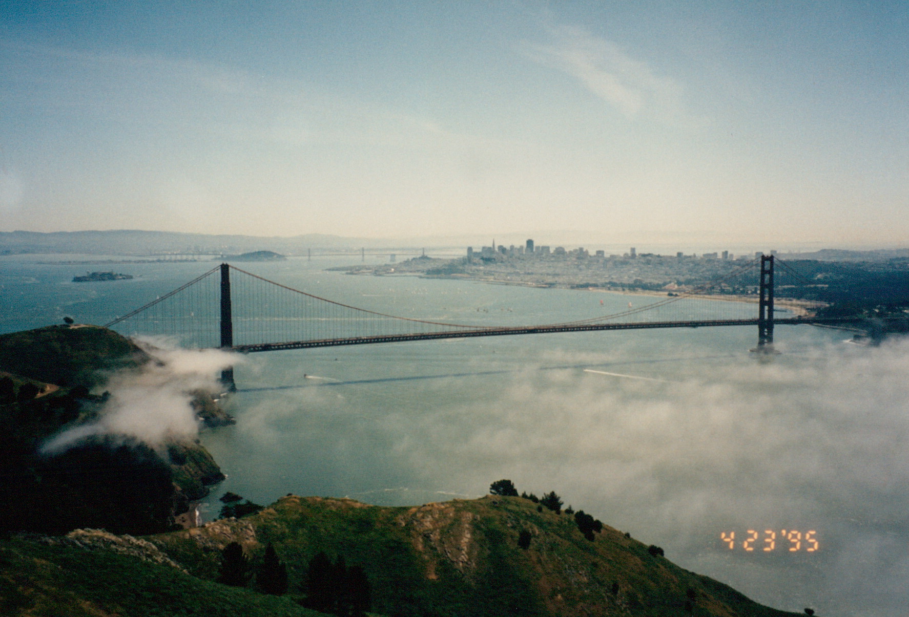 Scan of the Golden Gate Bridge from the Marin Headlands with a glowing orange '4 23 '95' LED date stamp in the bottom-right corner